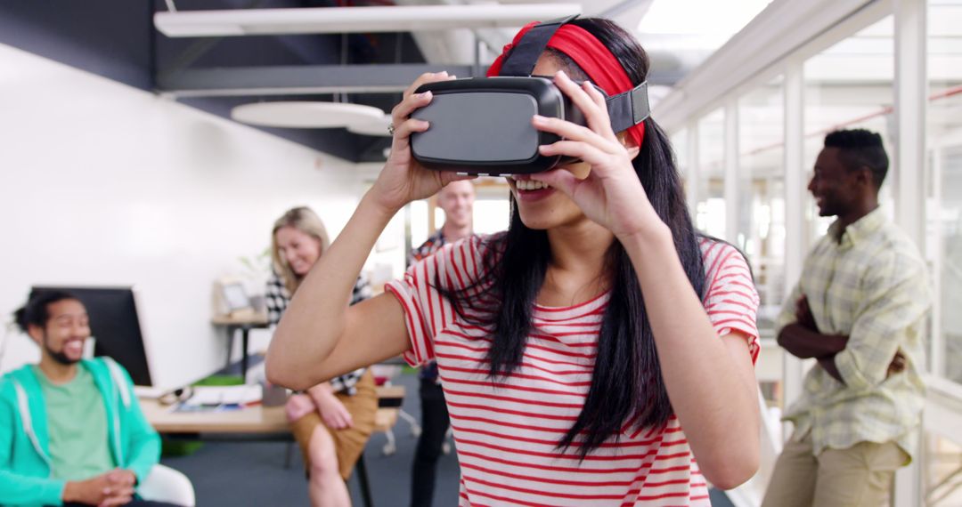 Diverse Group of Young Professionals Enjoying Virtual Reality in Modern Office - Free Images, Stock Photos and Pictures on Pikwizard.com