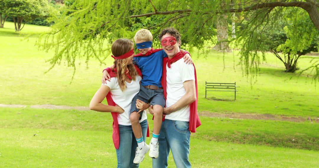 Family Dressed as Superheroes in Park on Sunny Day - Free Images, Stock Photos and Pictures on Pikwizard.com