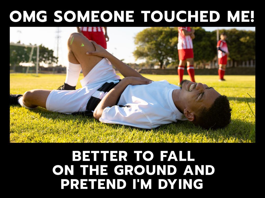 Dramatic Soccer Moment with Player on Ground in Protest