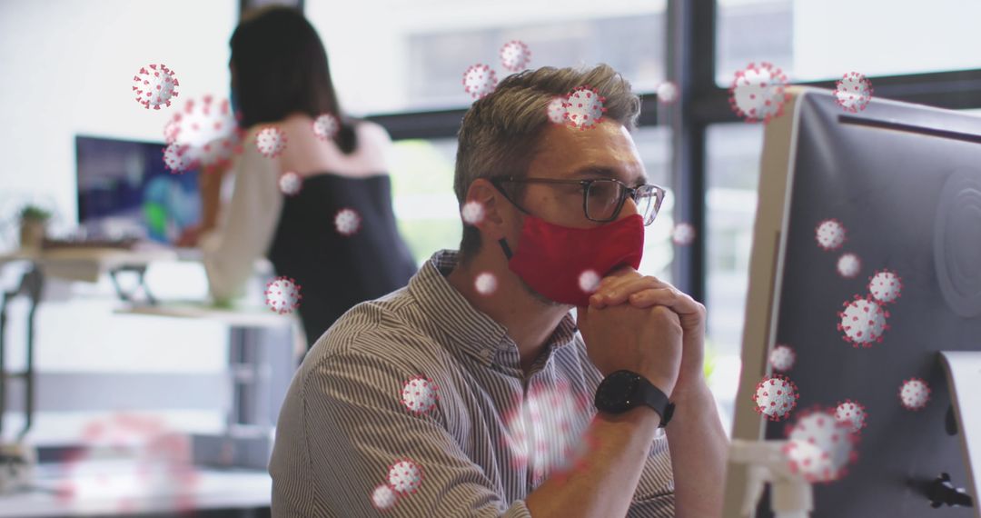 Masked Professional Using Computer in Office Amid COVID-19 Concept