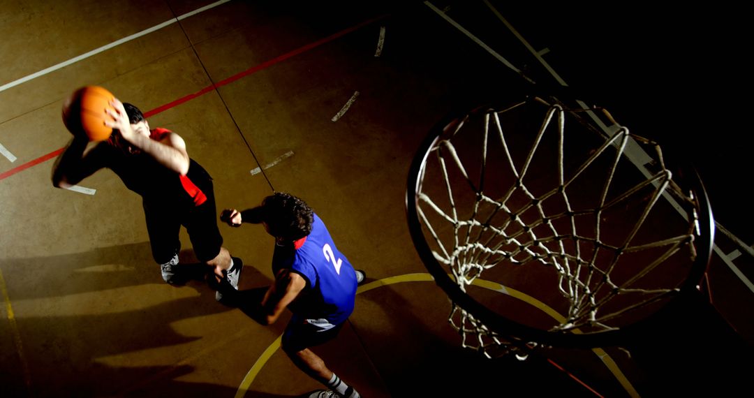 Basketball Players Competing in a High-Energy Game - Free Images, Stock Photos and Pictures on Pikwizard.com