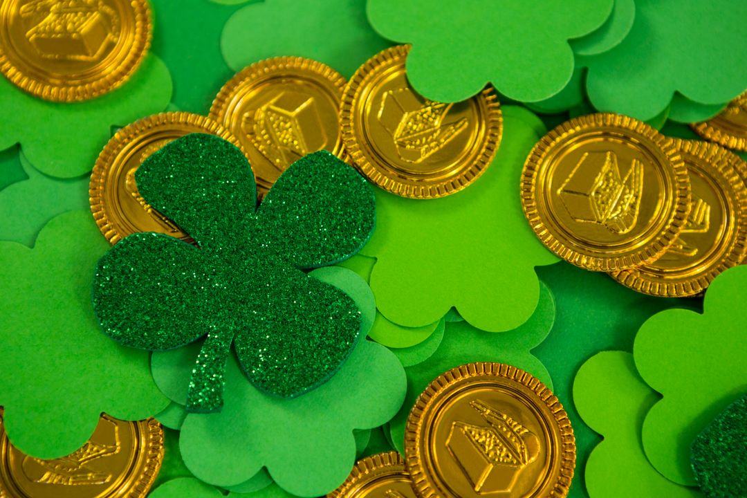 St Patricks Day shamrocks and gold chocolate coin - Free Images, Stock Photos and Pictures on Pikwizard.com