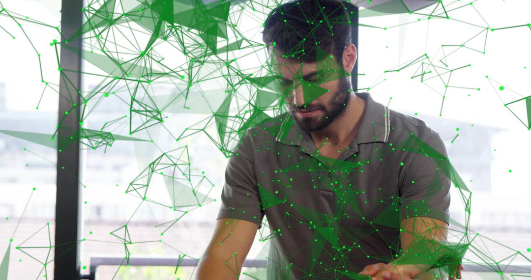 Bearded professional interacting with augmented green network visualization in workspace