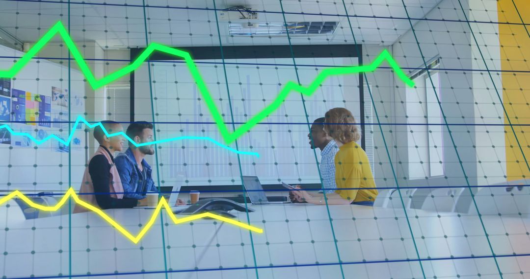 Business Professionals Analyzing Graphs in Modern Conference Room