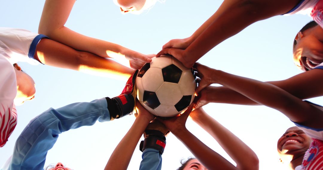 Team Huddle with Soccer Ball Motivational Unity - Free Images, Stock Photos and Pictures on Pikwizard.com