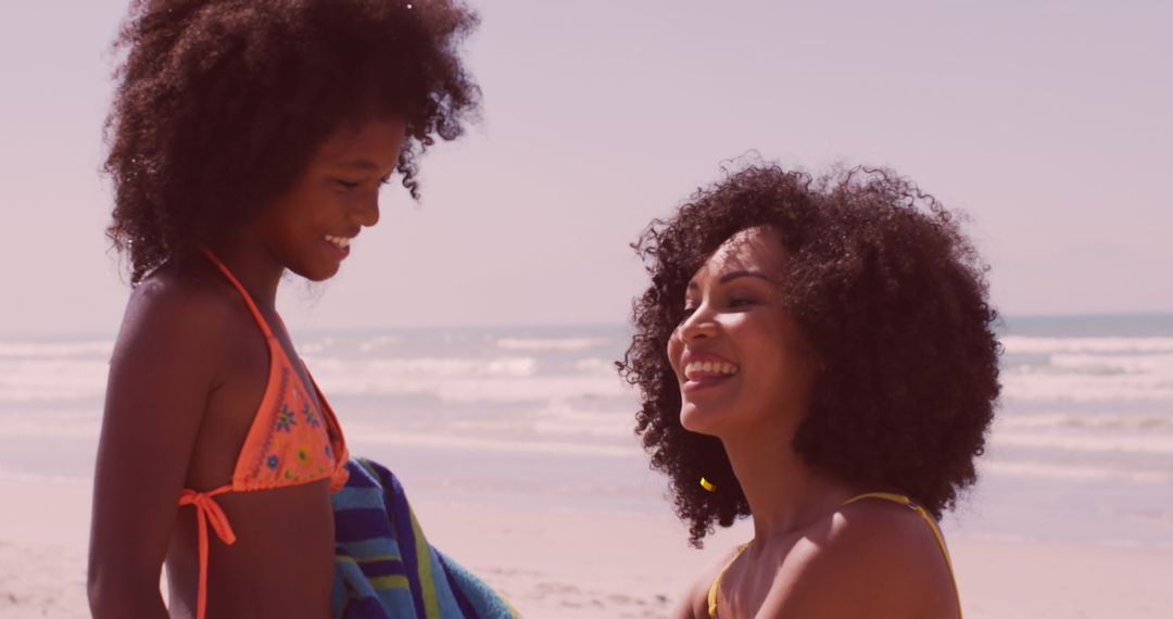 Mother and Daughter Smiling Together by the Seaside