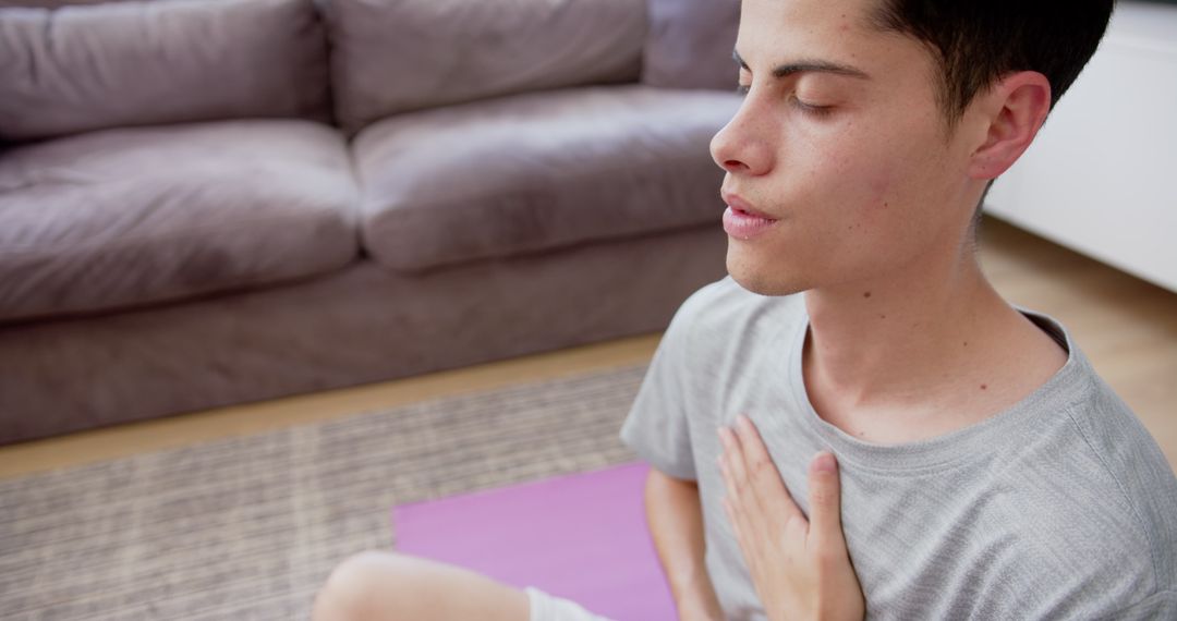 Young Man Practicing Mindful Meditation at Home for Wellbeing