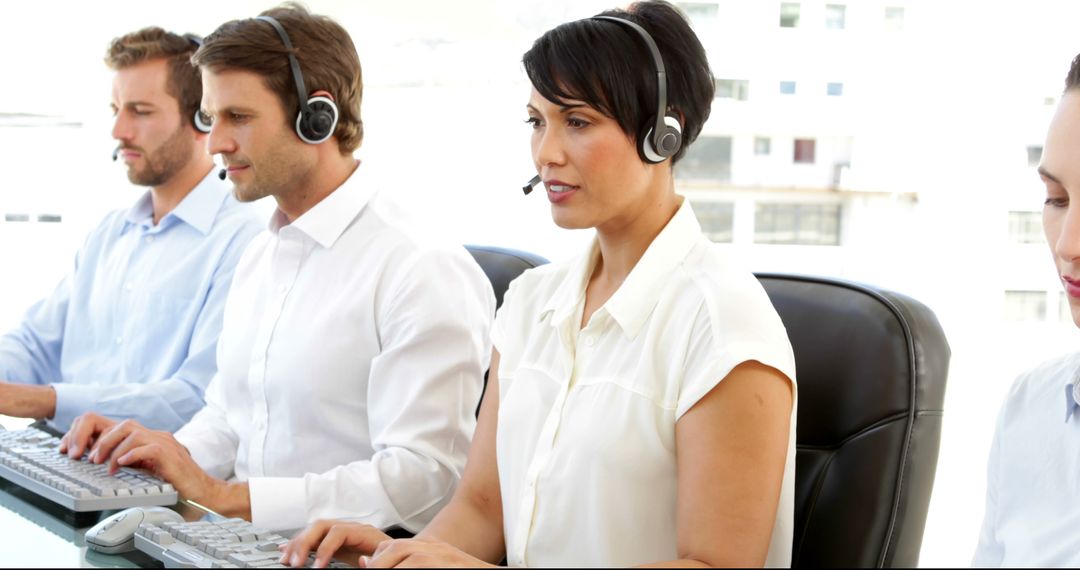 Diverse Customer Service Representatives Using Headsets and Computers - Free Images, Stock Photos and Pictures on Pikwizard.com