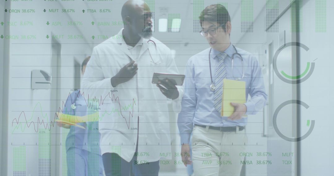 Doctors Collaborating in Hospital Corridor with Medical Records