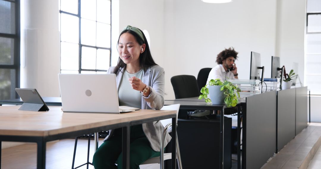 Colleagues Working Together in Modern Office Environment