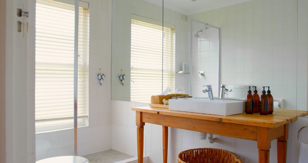 Bright Modern Bathroom Featuring Wooden Vanity Table and Contemporary Sink - Free Images, Stock Photos and Pictures on Pikwizard.com