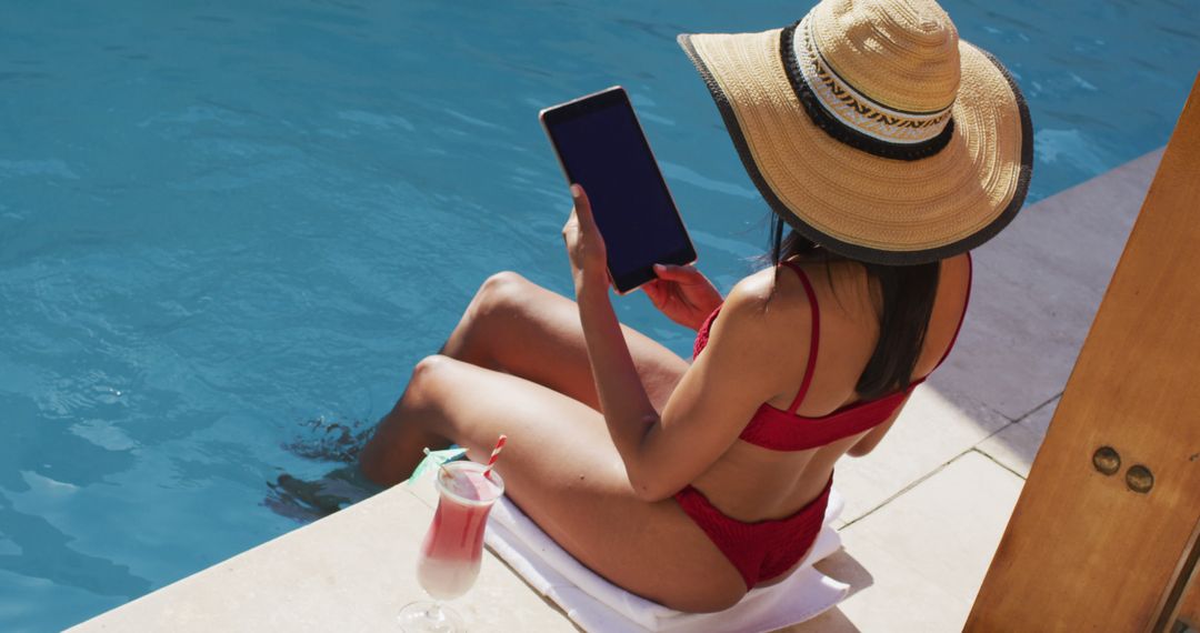 Woman Enjoying Poolside Relaxation with Tablet Outside Home - Free Images, Stock Photos and Pictures on Pikwizard.com