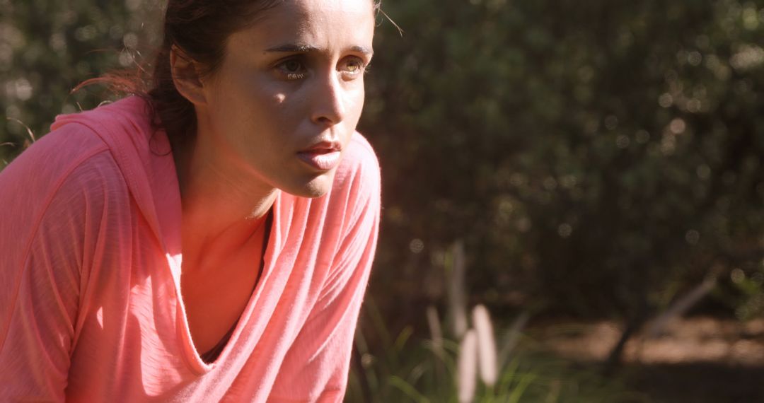 Exhausted Young Woman Pausing After Outdoor Exercise