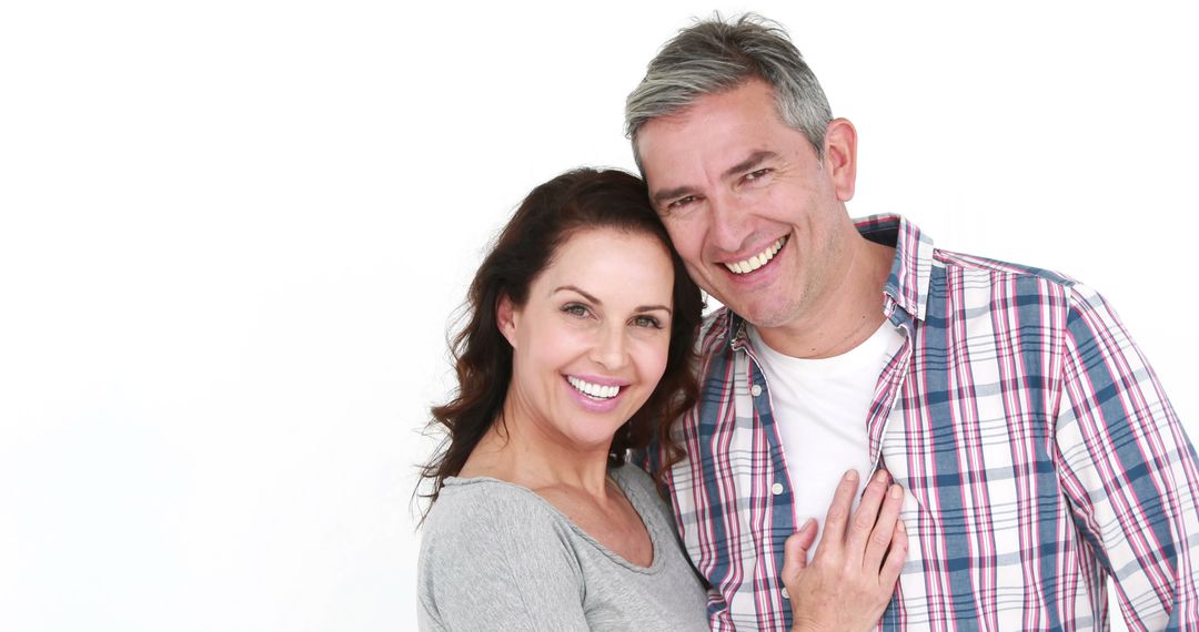 Happy Middle-Aged Couple Embracing with Joyful Expressions