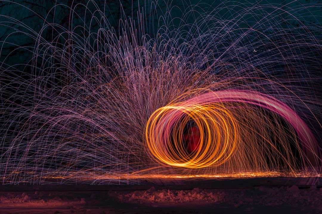Captivating Steel Wool Light Painting with Vibrant Sparking Trails