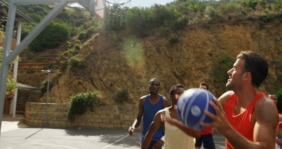 Men Playing Outdoor Basketball Game in Summer - Free Images, Stock Photos and Pictures on Pikwizard.com