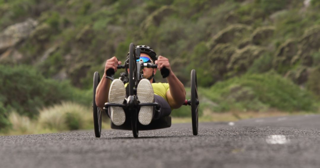 Focused Cyclist Riding Handcycle on Rare Mountain Road - Free Images, Stock Photos and Pictures on Pikwizard.com