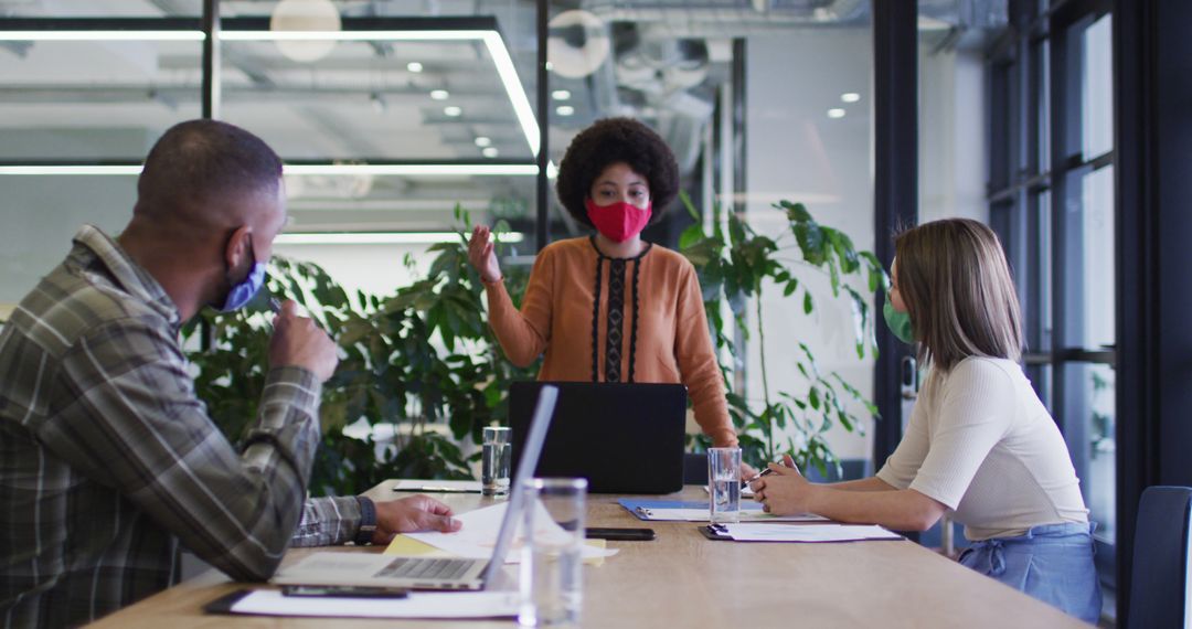 Office Team Brainstorming with Protective Masks in Modern Workplace - Free Images, Stock Photos and Pictures on Pikwizard.com