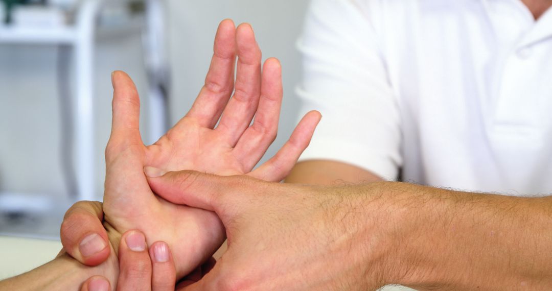 Physiotherapist Massaging Patient's Hand for Pain Relief - Free Images, Stock Photos and Pictures on Pikwizard.com