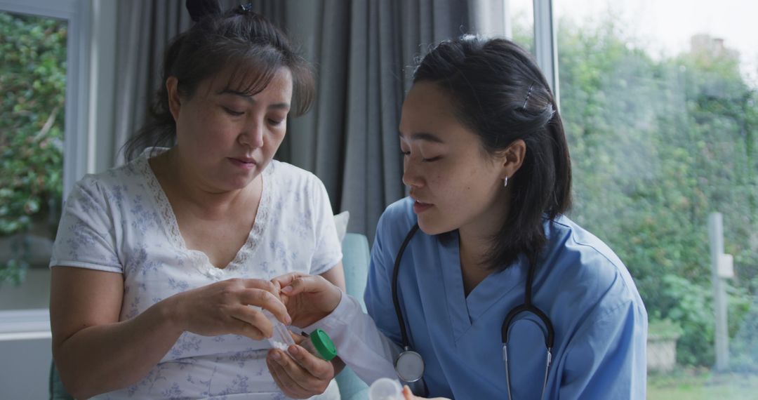 Nurse Assisting Senior Woman with Medication at Home - Free Images, Stock Photos and Pictures on Pikwizard.com