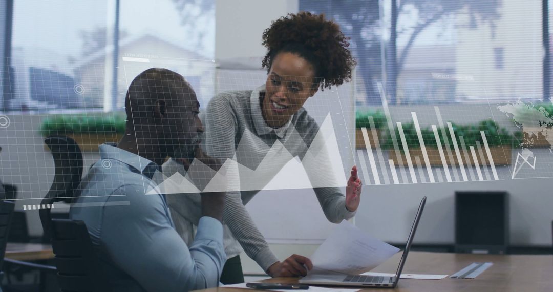 Colleagues Discussing Financial Strategies with Data Visualization