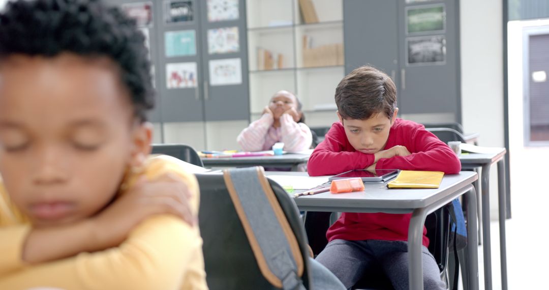 Children in Classroom Looking Bored During Lesson