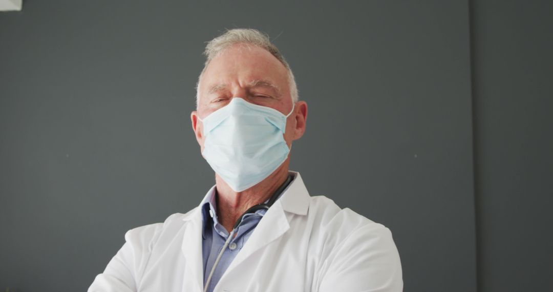 Portrait of caucasian senior male doctor wearing face mask - Free Images, Stock Photos and Pictures on Pikwizard.com