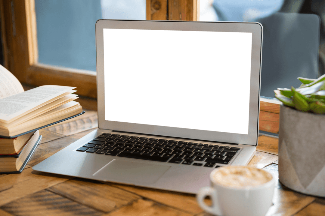 Transparent Laptop Screen in Coffee Shop with Books and Plant