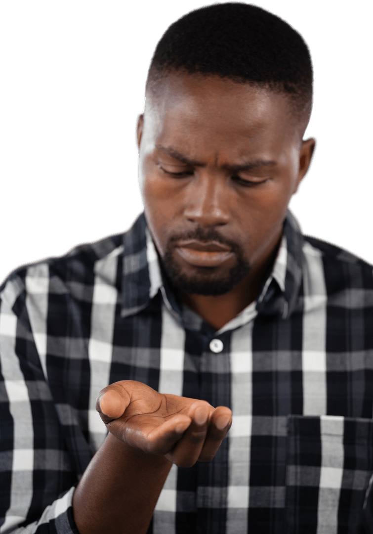 Focused Man Looking at Empty Hand on Transparent Background