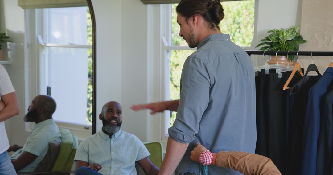 Friends Enjoying Suit Fitting with Tailor at Home