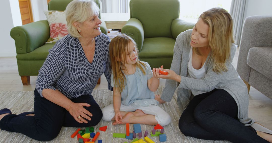 Three generations enjoying quality time together, playing with colorful building blocks - Free Images, Stock Photos and Pictures on Pikwizard.com