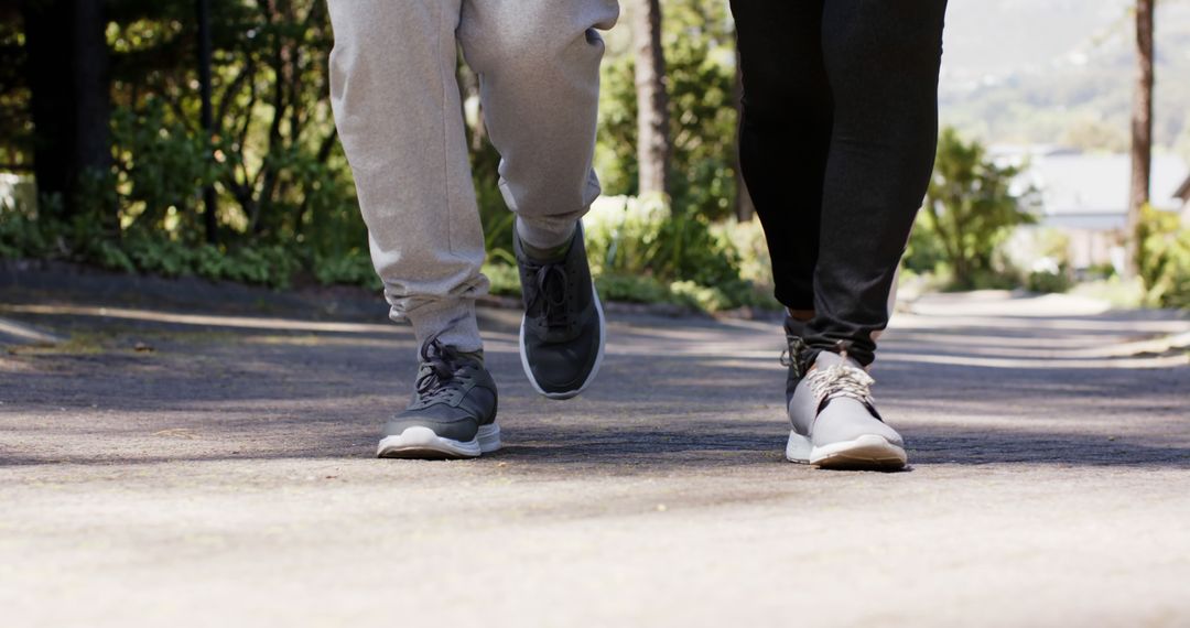 Couple Jogging Together in Park on Sunny Day - Free Images, Stock Photos and Pictures on Pikwizard.com