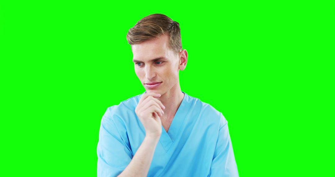 Thoughtful Male Nurse Wearing Scrubs Isolated on Green Screen - Free Images, Stock Photos and Pictures on Pikwizard.com
