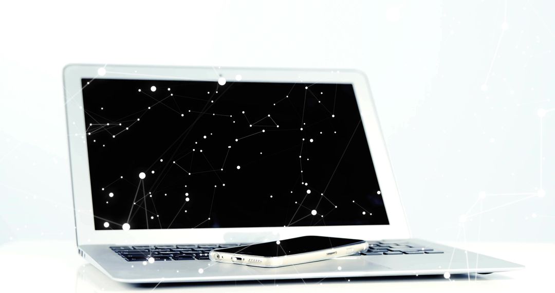 Minimalist Laptop and Smartphone with Digital Network Overlay for Modern Tech