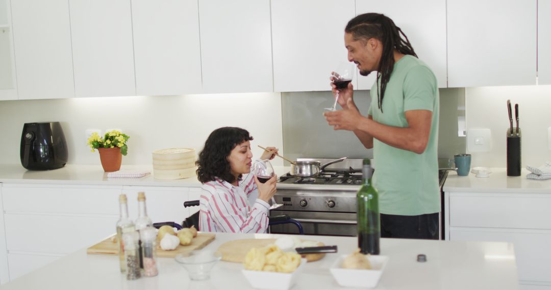 Man and woman with disabled child cooking together in modern kitchen - Free Images, Stock Photos and Pictures on Pikwizard.com