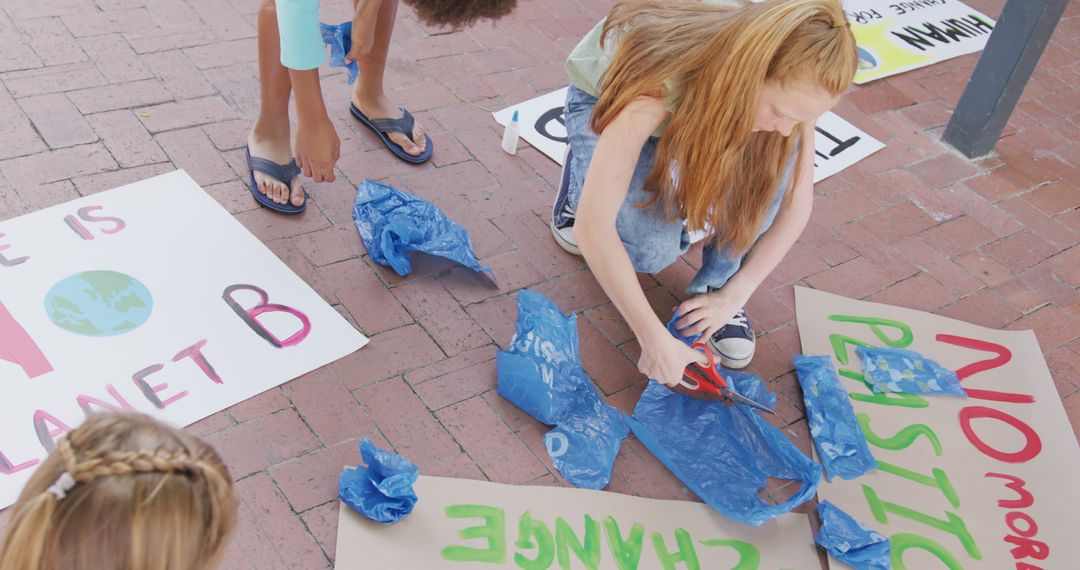 Children Making Environmental Awareness Signs for Climate Change Protest - Free Images, Stock Photos and Pictures on Pikwizard.com