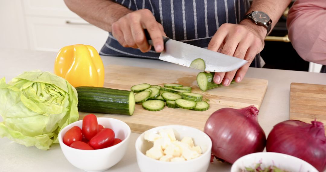 Couple Slicing Fresh Vegetables in Modern Home Kitchen