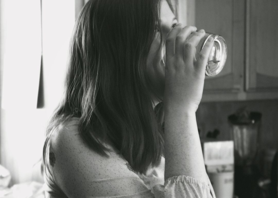 Grayscale Photo of Lady Drinking Water - Free Images, Stock Photos and Pictures on Pikwizard.com