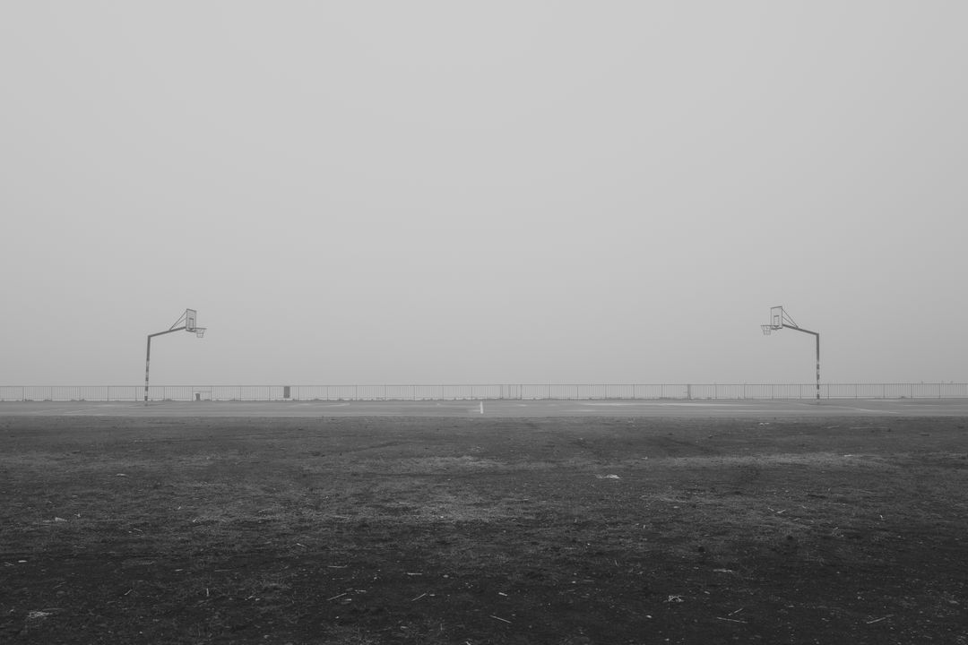 Abandoned Basketball Court in Fog with Minimalist Landscape - Free Images, Stock Photos and Pictures on Pikwizard.com