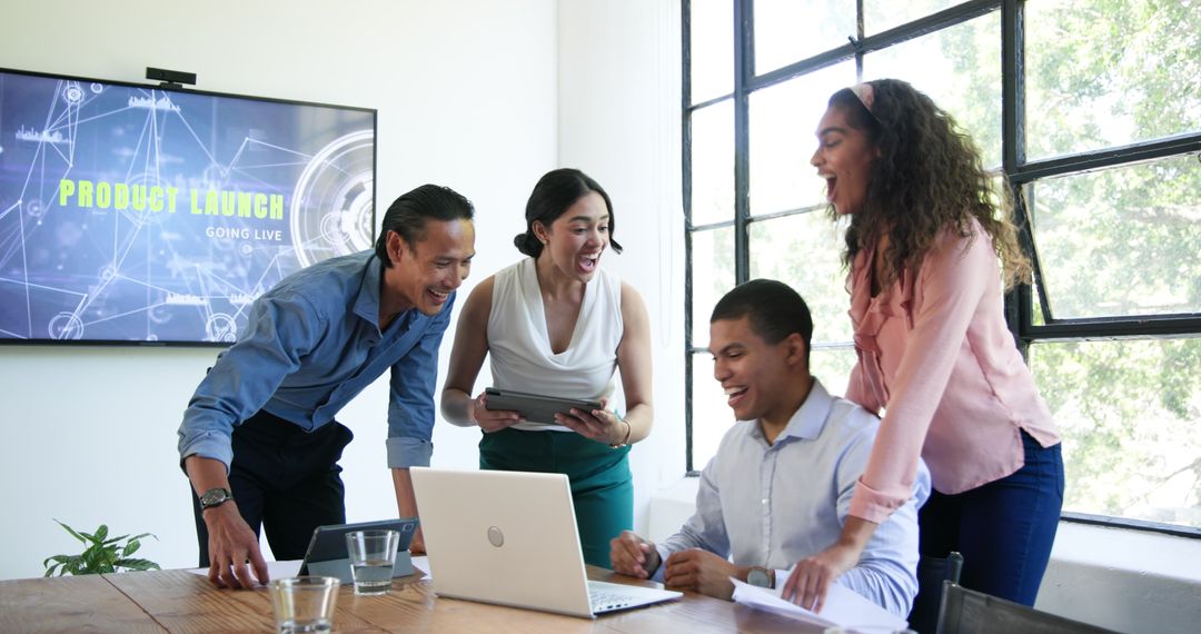 Diverse Team Celebrates Successful Product Launch in Office