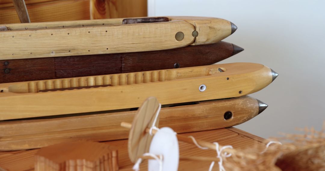 Close-Up of Wooden Loom Shuttle on Table in Workshop Setting