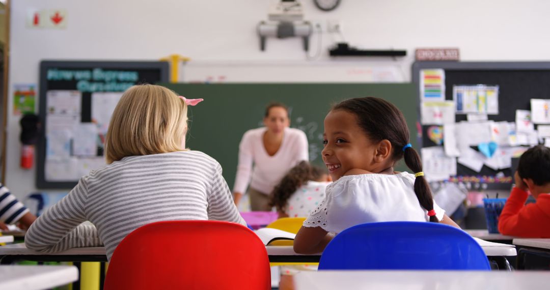 Happy Schoolgirl Smiling in Classroom with Diverse Classmates