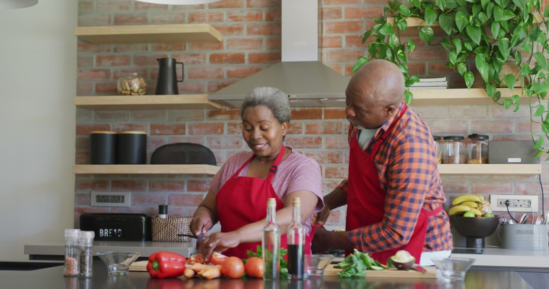 Smiling African American Couple Chopping Vegetables in Modern Kitchen - Free Images, Stock Photos and Pictures on Pikwizard.com