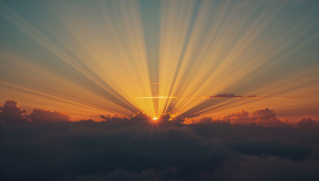 Radiant Sunrise Over Cloud Layer with Bright Horizon Glow