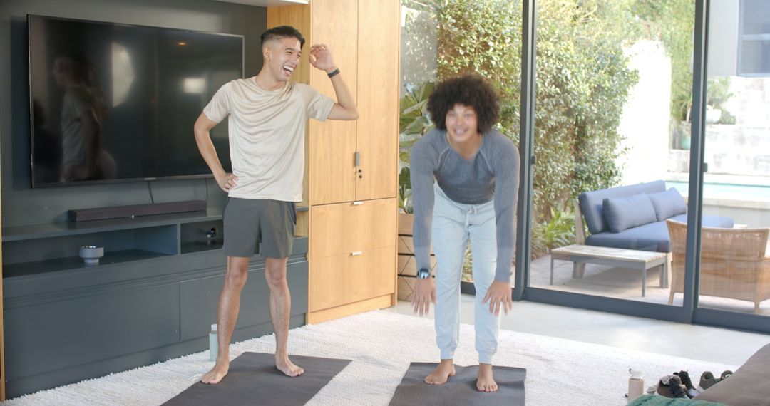 Two Diverse Friends Stretching in Modern Living Room