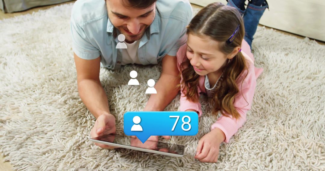 Father and Daughter Viewing Tablet Receiving Social Notifications
