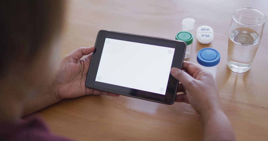 Person Holding Digital Tablet at Home - Free Images, Stock Photos and Pictures on Pikwizard.com