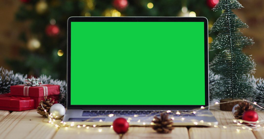 Laptop with Green Screen Surrounded by Christmas Decor