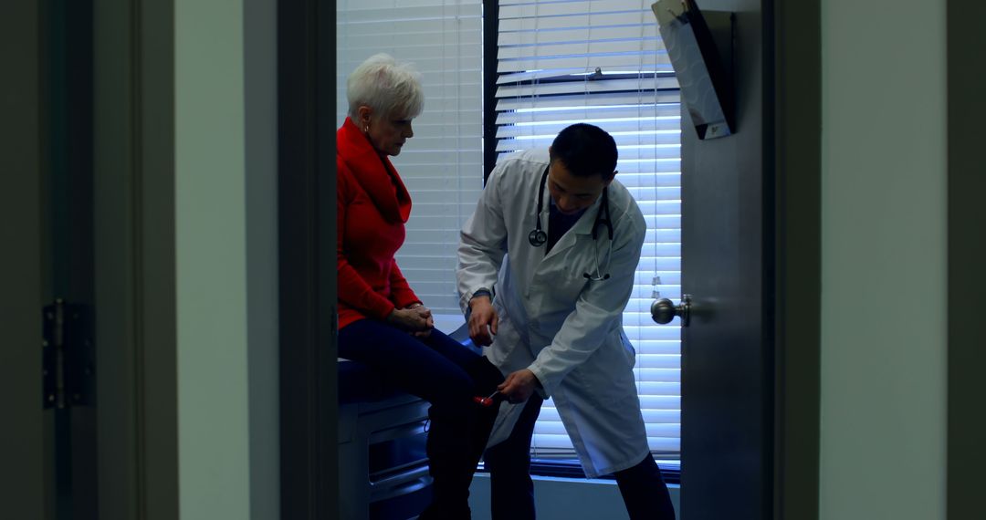 Doctor Examining Elderly Patient's Knee in Medical Office - Free Images, Stock Photos and Pictures on Pikwizard.com