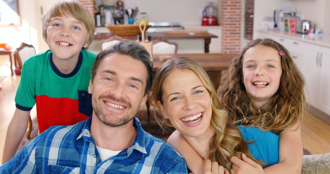 Happy Family Smiling Together in Home Kitchen - Free Images, Stock Photos and Pictures on Pikwizard.com